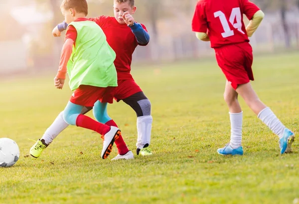 depositphotos_173486254-stock-photo-young-children-players-football-match